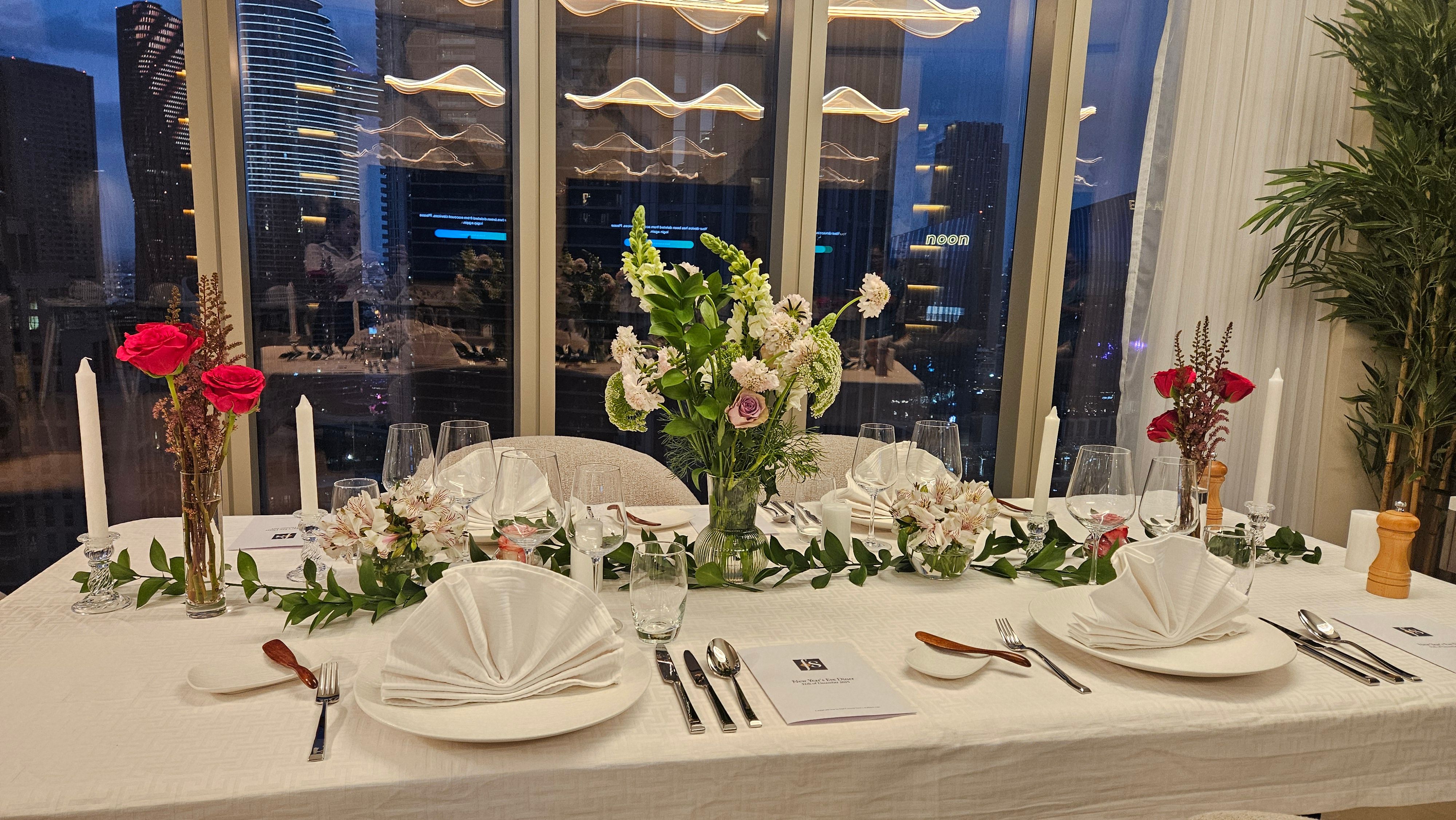 Festive table against the Dubai skyline.
