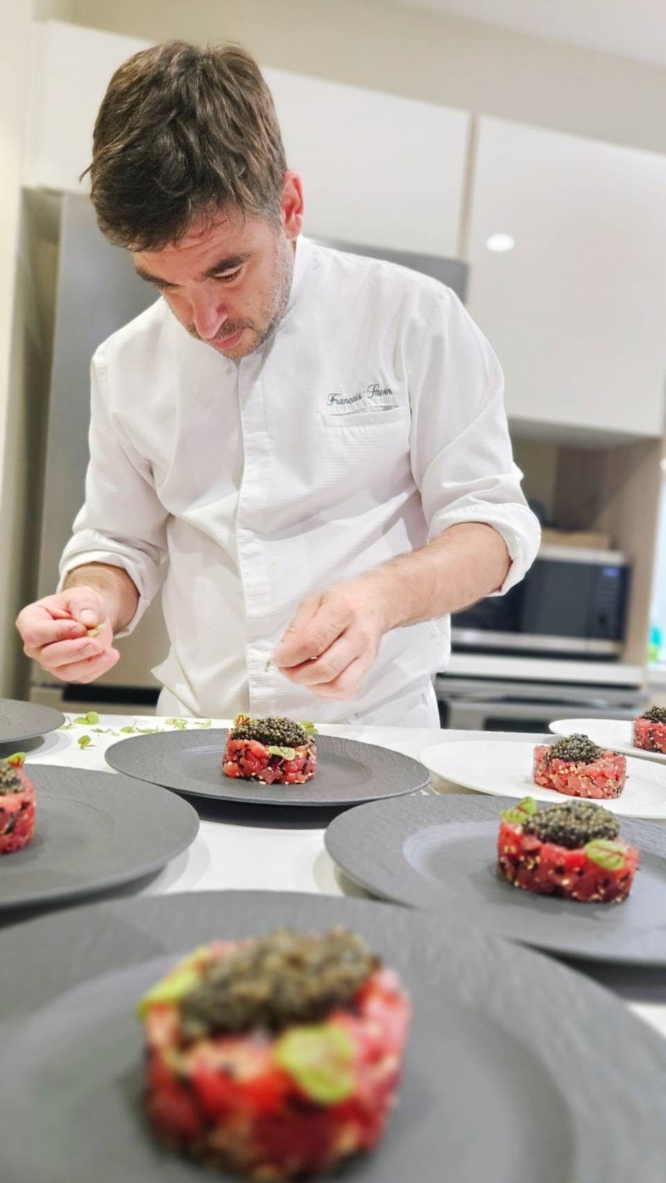Chef François Savin plating his bluefin tuna tartare with Imperial Osetra caviar, at a private dinner in Monaco.